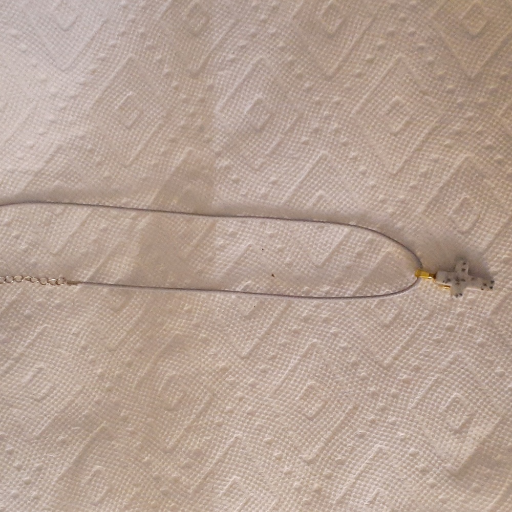 Spotted gray stone cross pendant